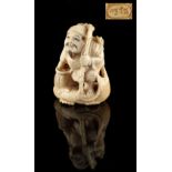 The Ronald Hart Collection of Japanese Netsukes - a carved ivory netsuke modelled as a fisherman