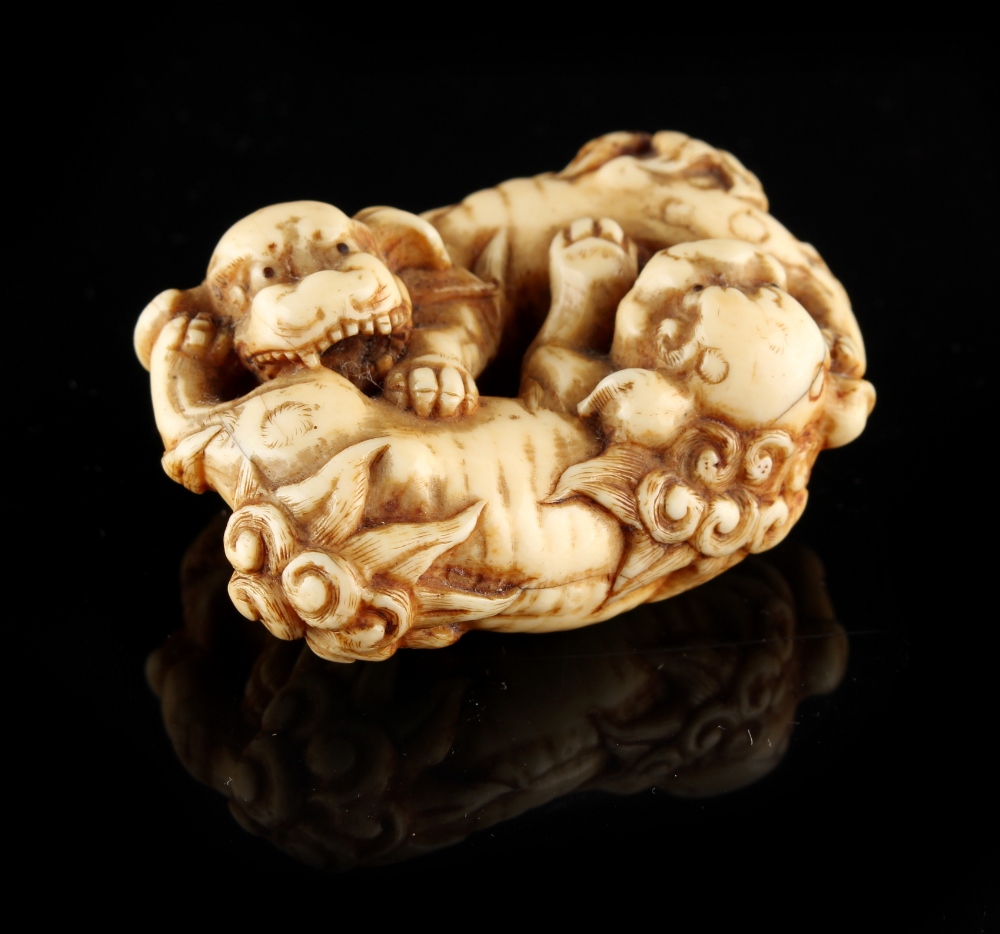 The Ronald Hart Collection of Japanese Netsukes - a carved ivory netsuke modelled as two recumbent - Image 2 of 4