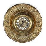 A late 19th / early 20th century French embossed brass circular cased wall clock, with enamel