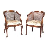Property of a lady - two similar cane panelled bergere tub chairs, first half 20th century (2) (