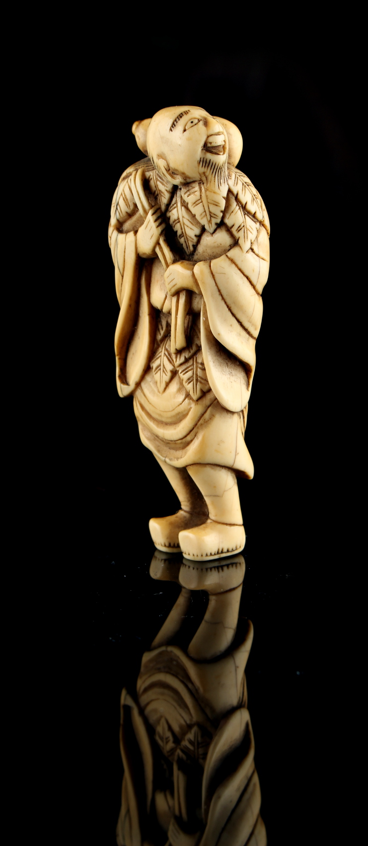 The Ronald Hart Collection of Japanese Netsukes - a large carved ivory netsuke modelled as a