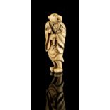 The Ronald Hart Collection of Japanese Netsukes - a large carved ivory netsuke modelled as a