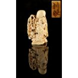 The Ronald Hart Collection of Japanese Netsukes - a carved ivory netsuke modelled as Fukurokuju,