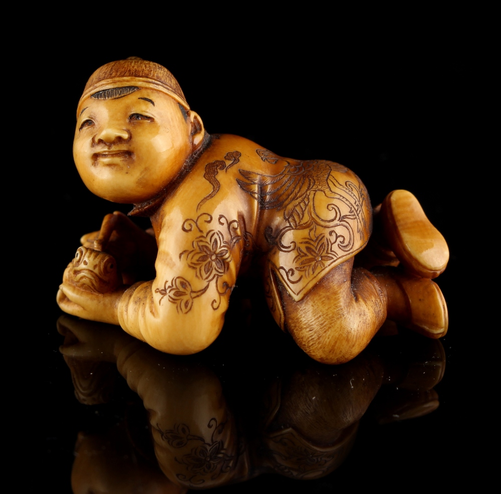 The Ronald Hart Collection of Japanese Netsukes - a carved ivory netsuke modelled as a recumbent boy - Image 5 of 8