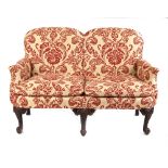 Property of a gentleman - a George II style two-seater sofa, second quarter 20th century, with red