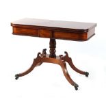 Property of a gentleman - an early 19th century Regency period mahogany swivel-top foldover tea