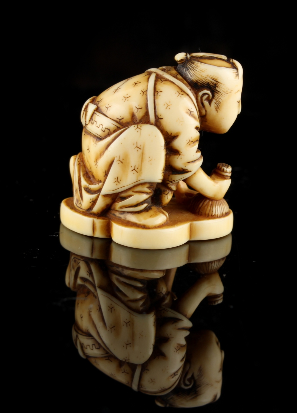 The Ronald Hart Collection of Japanese Netsukes - a carved ivory netsuke modelled as a kneeling - Image 3 of 6