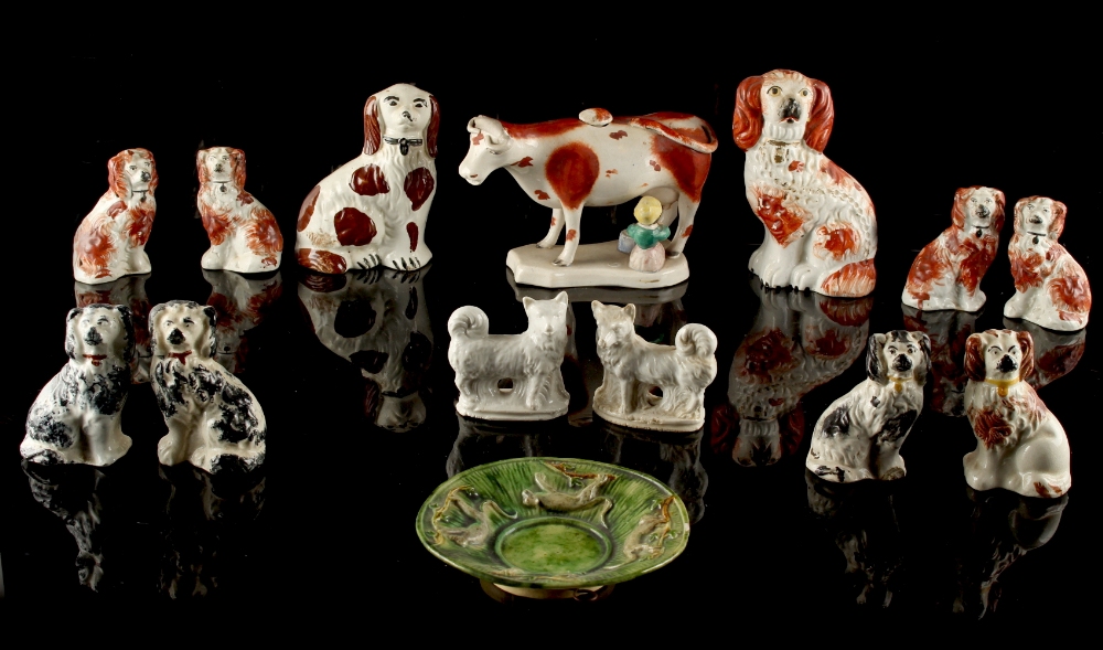 Property of a lady - a collection of ten Victorian Staffordshire models of seated spaniels,