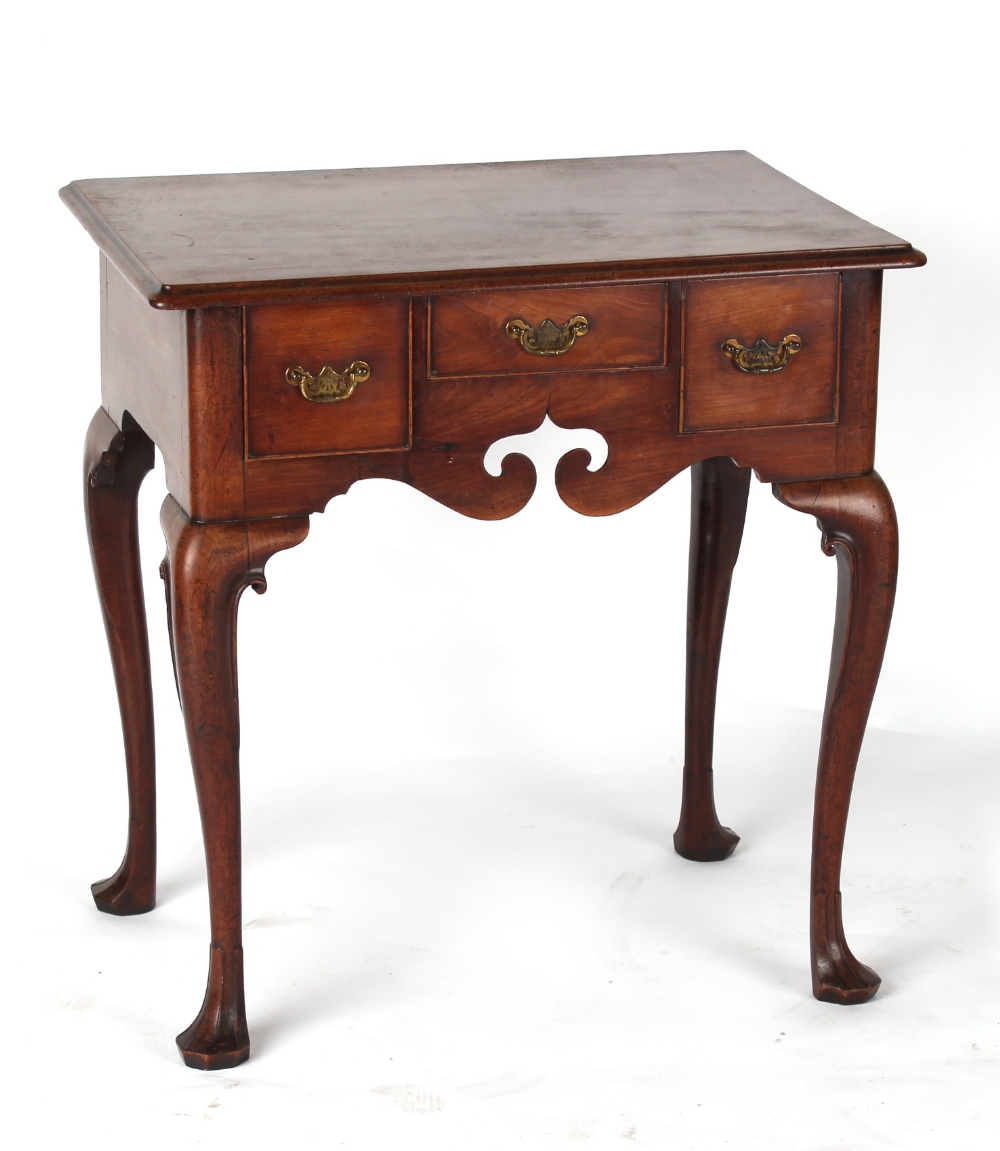 Property of a lady - a George II red walnut lowboy, circa 1750, with shaped frieze & cabriole legs