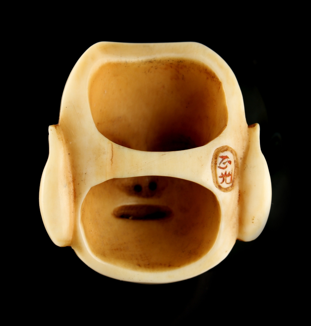 The Ronald Hart Collection of Japanese Netsukes - a carved ivory netsuke modelled as a mask of - Image 2 of 6