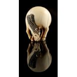 The Ronald Hart Collection of Japanese Netsukes - a carved ivory netsuke modelled as a grazing