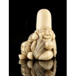 The Ronald Hart Collection of Japanese Netsukes - a carved ivory netsuke modelled as Fukurokuju,