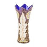 Property of a gentleman - a large overlaid blue glass vase with enamel painted floral decorations,
