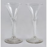 Property of a lady - two mid 18th century Georgian air twist wine glasses, each of drawn trumpet