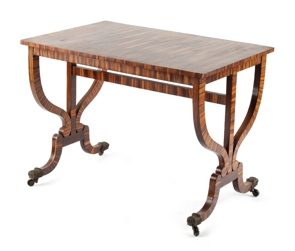 Property of a lady - a calamander rectangular topped centre table, with shaped end supports united