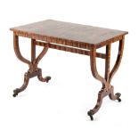 Property of a lady - a calamander rectangular topped centre table, with shaped end supports united