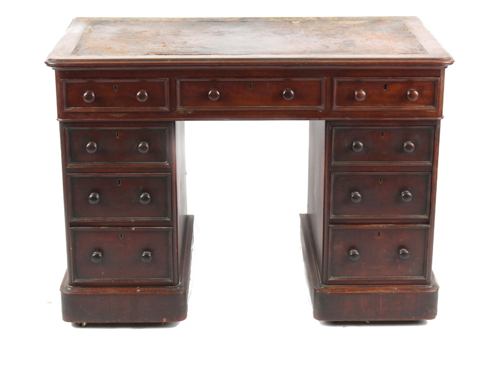 Property of a gentleman - a Victorian mahogany twin pedestal desk, with leather inset top above nine