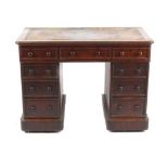 Property of a gentleman - a Victorian mahogany twin pedestal desk, with leather inset top above nine