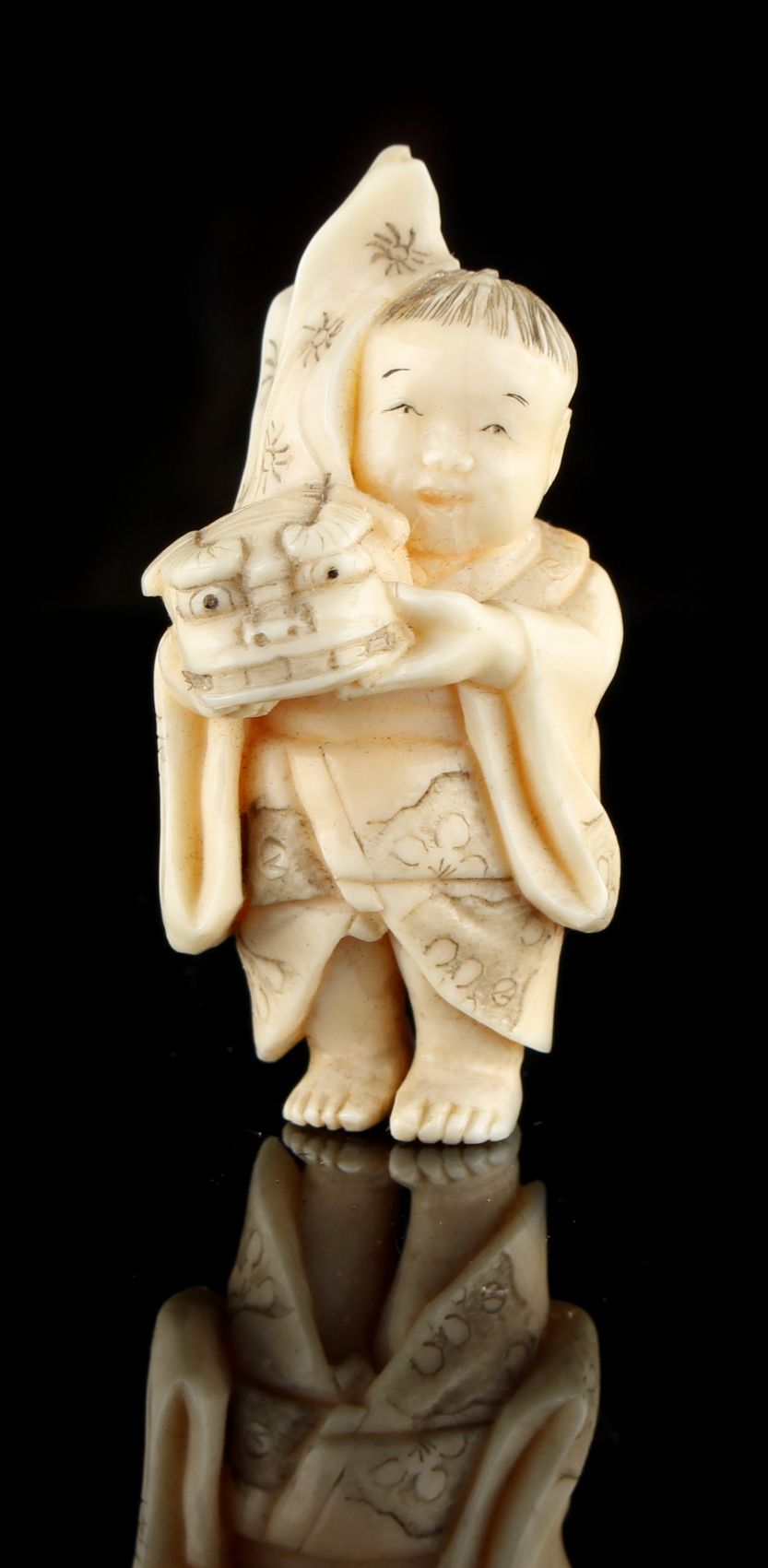 The Ronald Hart Collection of Japanese Netsukes - a carved ivory netsuke modelled as a boy - Image 2 of 4