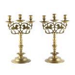 Property of a lady - a pair of heavy brass 'Lion of Judah' three light candelabra, each 16.5ins. (