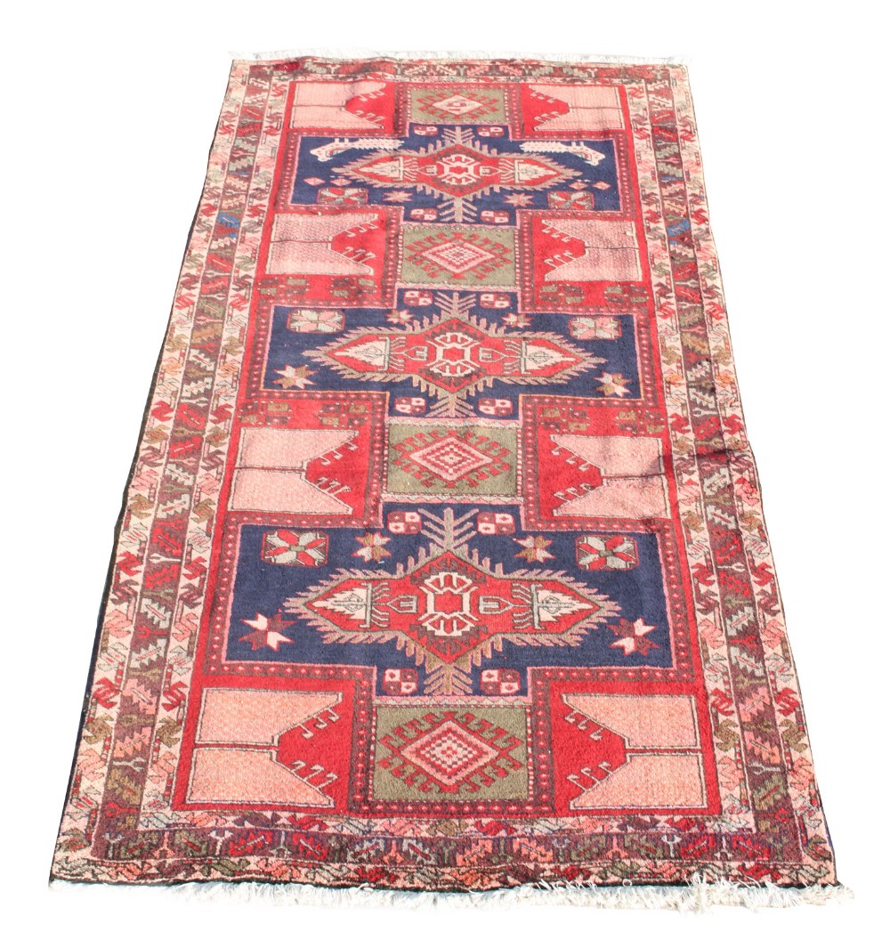 An Ardebil woollen hand-made runner with geometric design, 126 by 57ins. (320 by 145cms.) (see