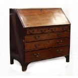 Property of a lady - a George III mahogany fall-front bureau with fitted interior above two
