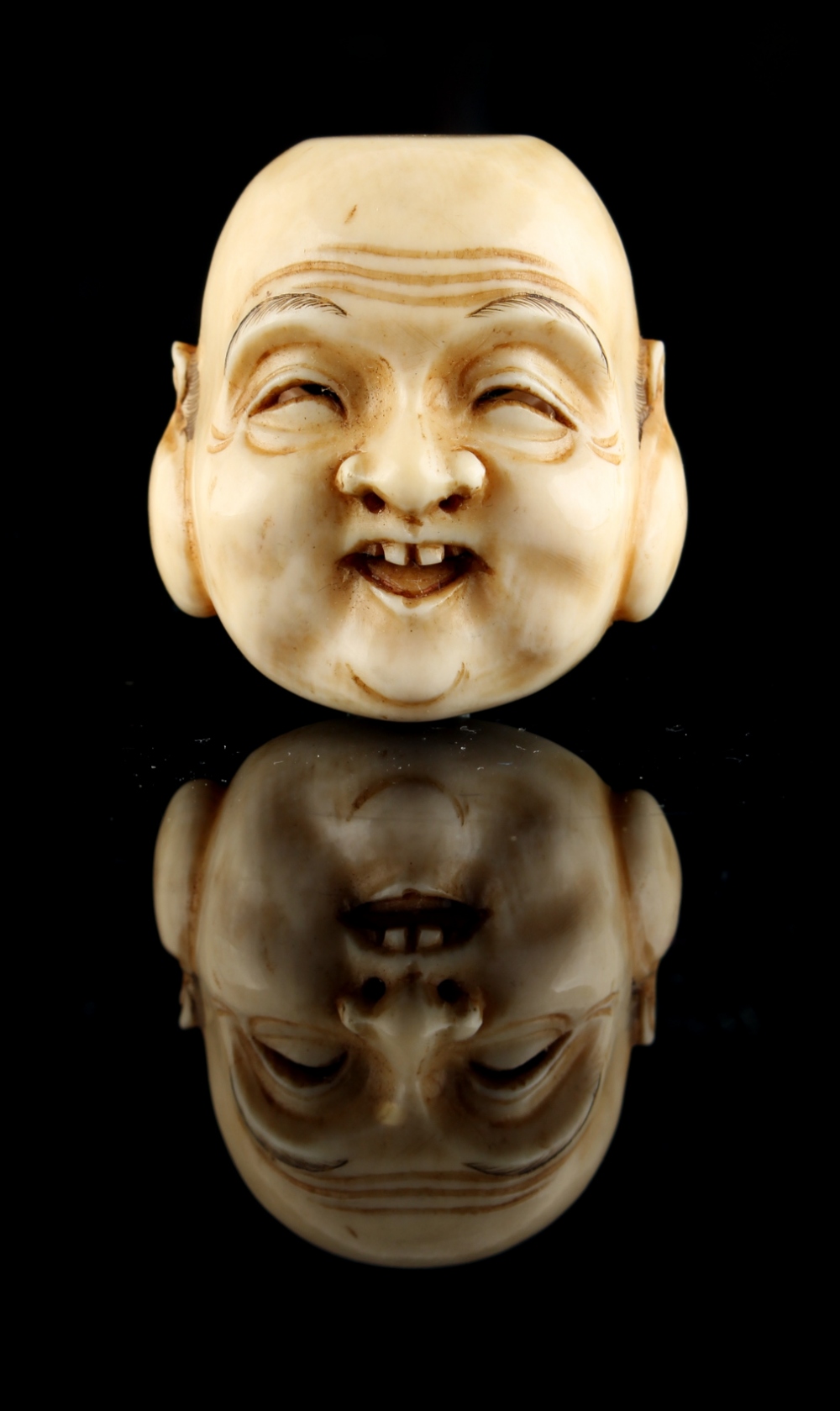 The Ronald Hart Collection of Japanese Netsukes - a carved ivory netsuke modelled as a mask of - Image 6 of 6