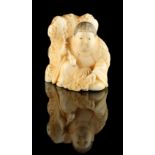 The Ronald Hart Collection of Japanese Netsukes - a carved ivory netsuke modelled as a boy seated
