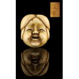 The Ronald Hart Collection of Japanese Netsukes - a carved ivory netsuke modelled as a noh mask