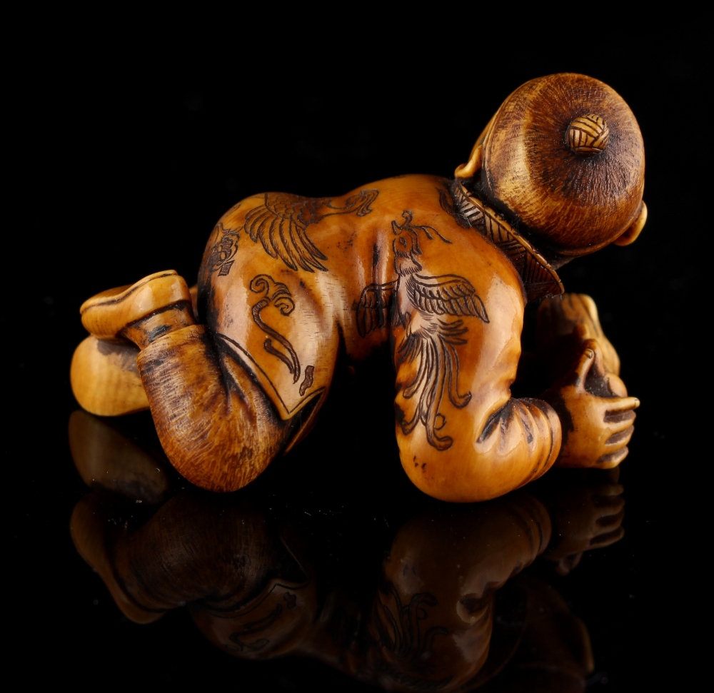 The Ronald Hart Collection of Japanese Netsukes - a carved ivory netsuke modelled as a recumbent boy - Image 3 of 8