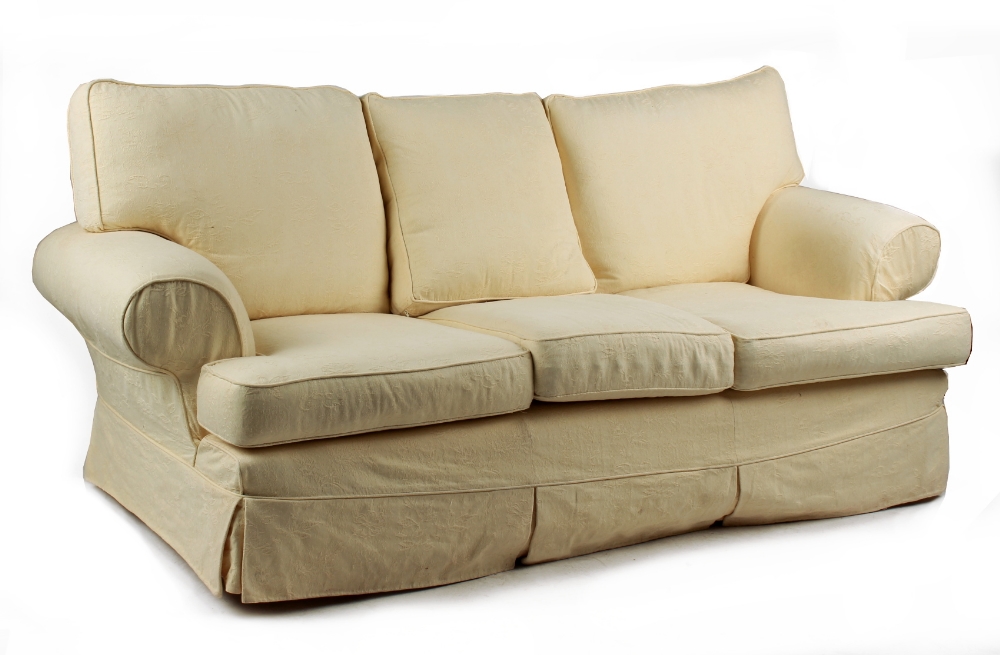 Property of a gentleman - a Multi York pale yellow upholstered three seater sofa, 83ins. (210cms.)