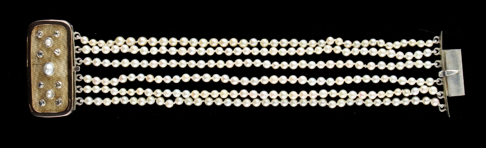 A pearl six row bracelet, the pearls approximately 4.3mm diameter, the yellow gold & silver clasp