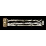 A pearl six row bracelet, the pearls approximately 4.3mm diameter, the yellow gold & silver clasp