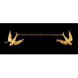 A late 19th / early 20th century 15ct yellow gold double ended brooch, modelled as two swallows in