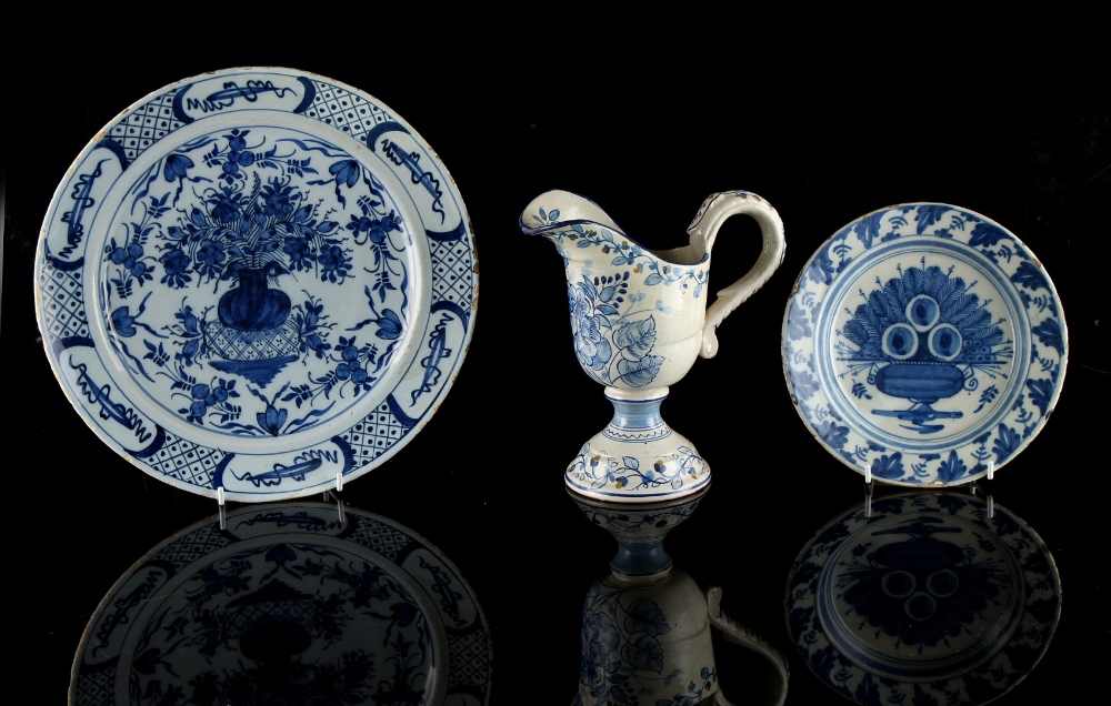 Property of a gentleman - two 18th century Delft blue & white plates, the larger 12ins. (30.5cms.)