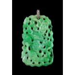 A Chinese carved & pierced jadeite rectangular pendant plaque, modelled as a bird among lotus, the