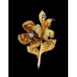 Tiffany - an 18ct yellow gold sapphire & diamond floral spray brooch, one flower with four hinged