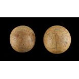 Property of a lady - two antique ivory balls, the smaller slightly ovoid, the larger 1.8ins. (4.