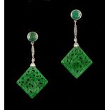 A pair of white gold Chinese carved jadeite emerald & diamond pendant drop earrings, each carved &