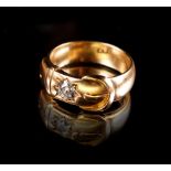 A heavy 18ct gold buckle ring set with an Old European cut diamond weighing approximately 0.44