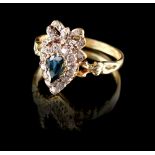 An 18ct yellow gold sapphire & diamond ring, the pear shaped cut sapphire set within a conforming