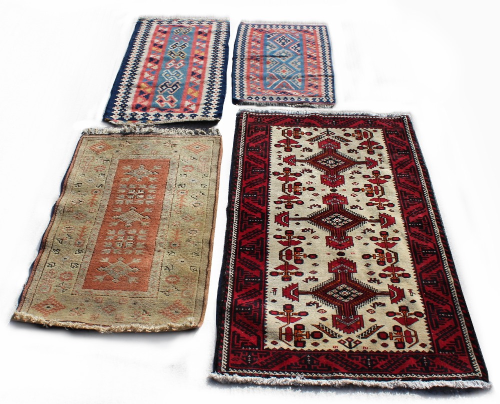 Property of a lady - an Afghan rug, 72 by 41ins. (183 by 104cms.); together with a Turkish rug;