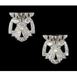 A pair of Art Deco style diamond clips, the round brilliant & baguette cut diamonds weighing an