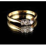 Property of a deceased estate - an 18ct yellow gold three stone diamond ring, the estimated total