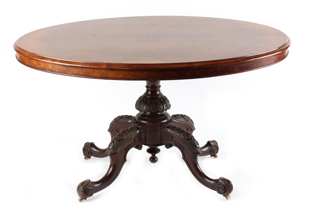 Property of a lady - a Victorian burr walnut oval tilt-top loo table, 51ins. (129.5cms.) long (see