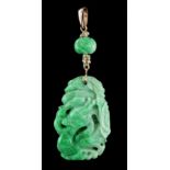 A Chinese carved jadeite pendant modelled as a dragon & fish, suspended below a carved jadeite