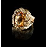 A modern 14ct yellow gold citrine & diamond ring, the large oval cut citrine measuring approximately