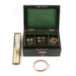 Property of a lady - a green leather jewellery box containing assorted jewellery including a 9ct