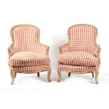 Property of a gentleman - a pair of French Louis XV style carved beechwood framed fauteuils with red