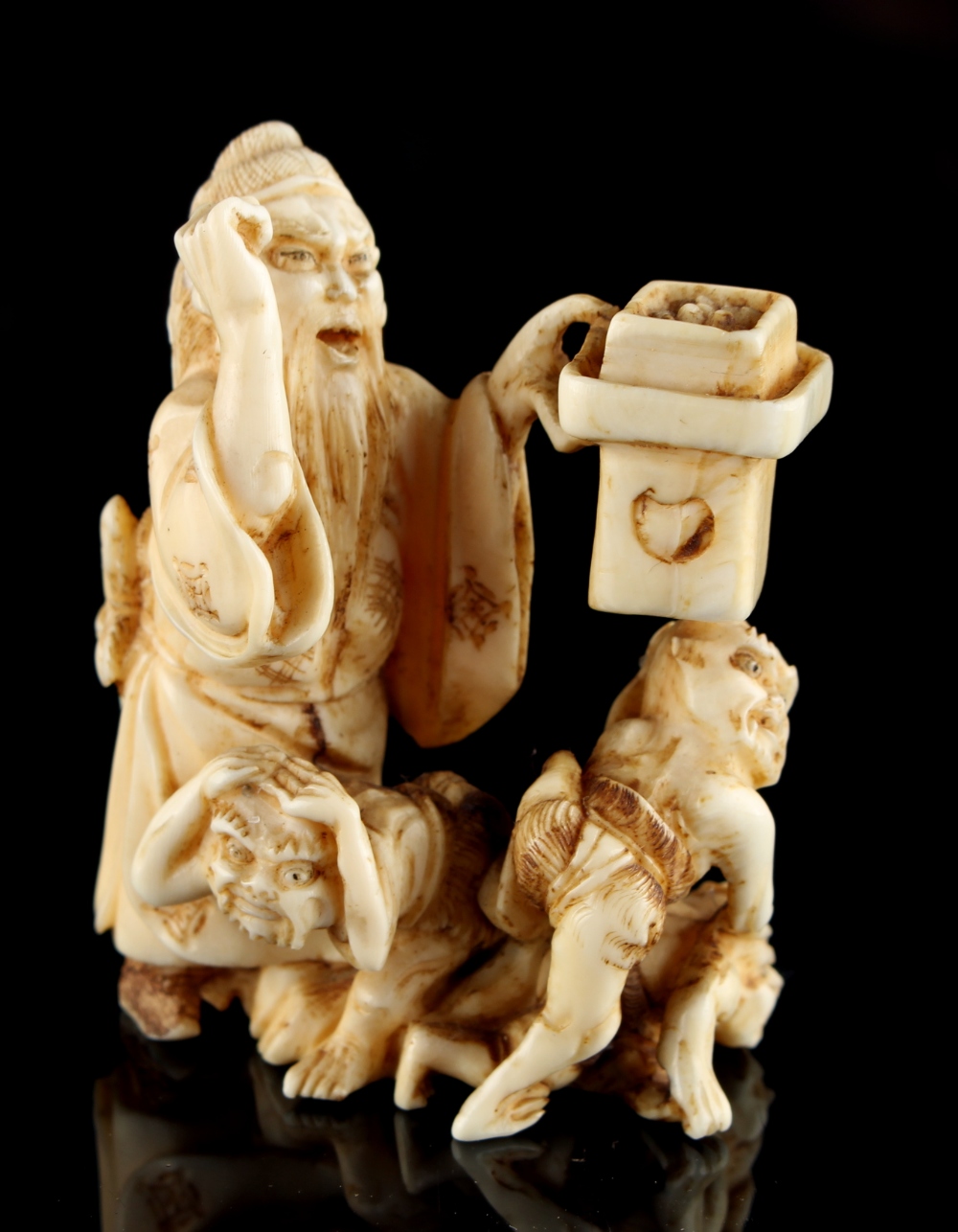 The Ronald Hart Collection of Japanese Netsukes - a carved ivory netsuke modelled as a standing